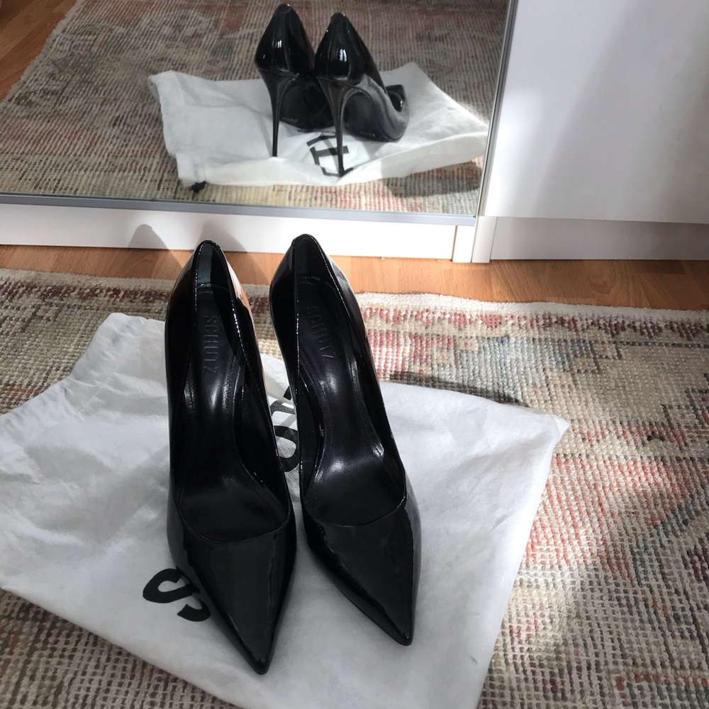 Schutz patent leather heels.
